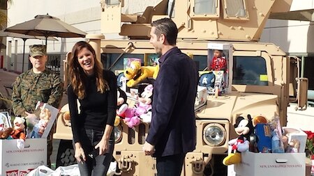 Michelle Stafford, Frank Valentini gathering Toys for Tots