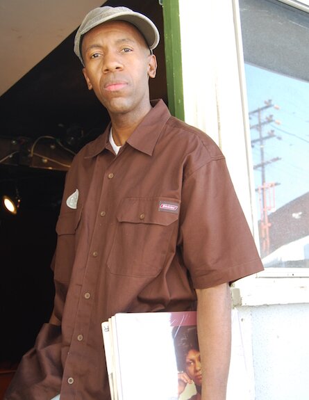 Tommie Lee Ervin -- Soap opera extra, hotel staffer and nighttime DJ on his way to a gig